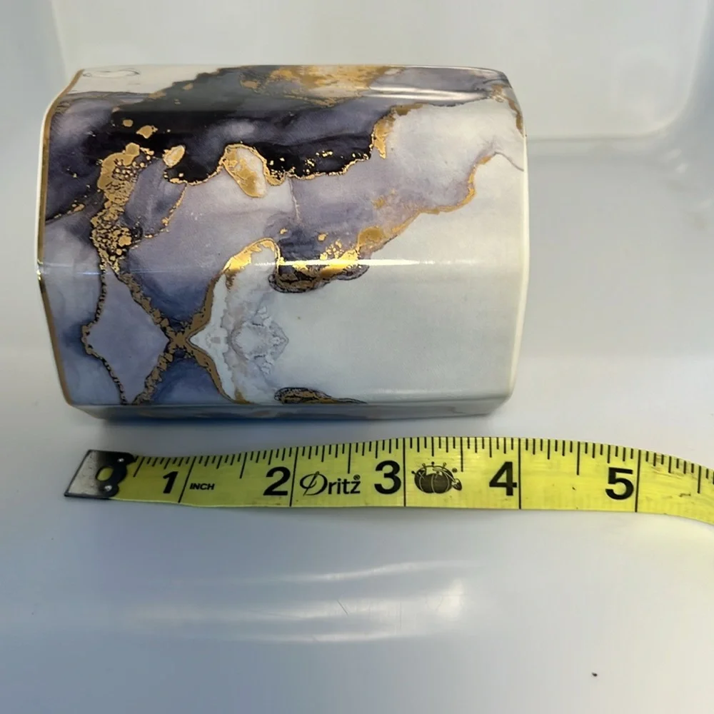 Ceramic cup, purple, gold, white.